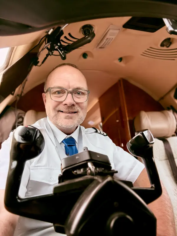 Ben Davis, commercial pilot, on the flight deck of a Cessna Citation X